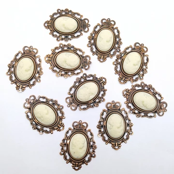 Bross ovális 10 db 5x3.8 cm, bronzos női portréval