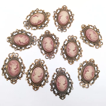 Bross ovális 10 db 5x3.8 cm, bronzos rózsaszín női portréval