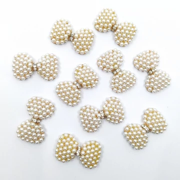 Bross gyöngyökkel masni alakú 10 db 3x1.9 cm, arany