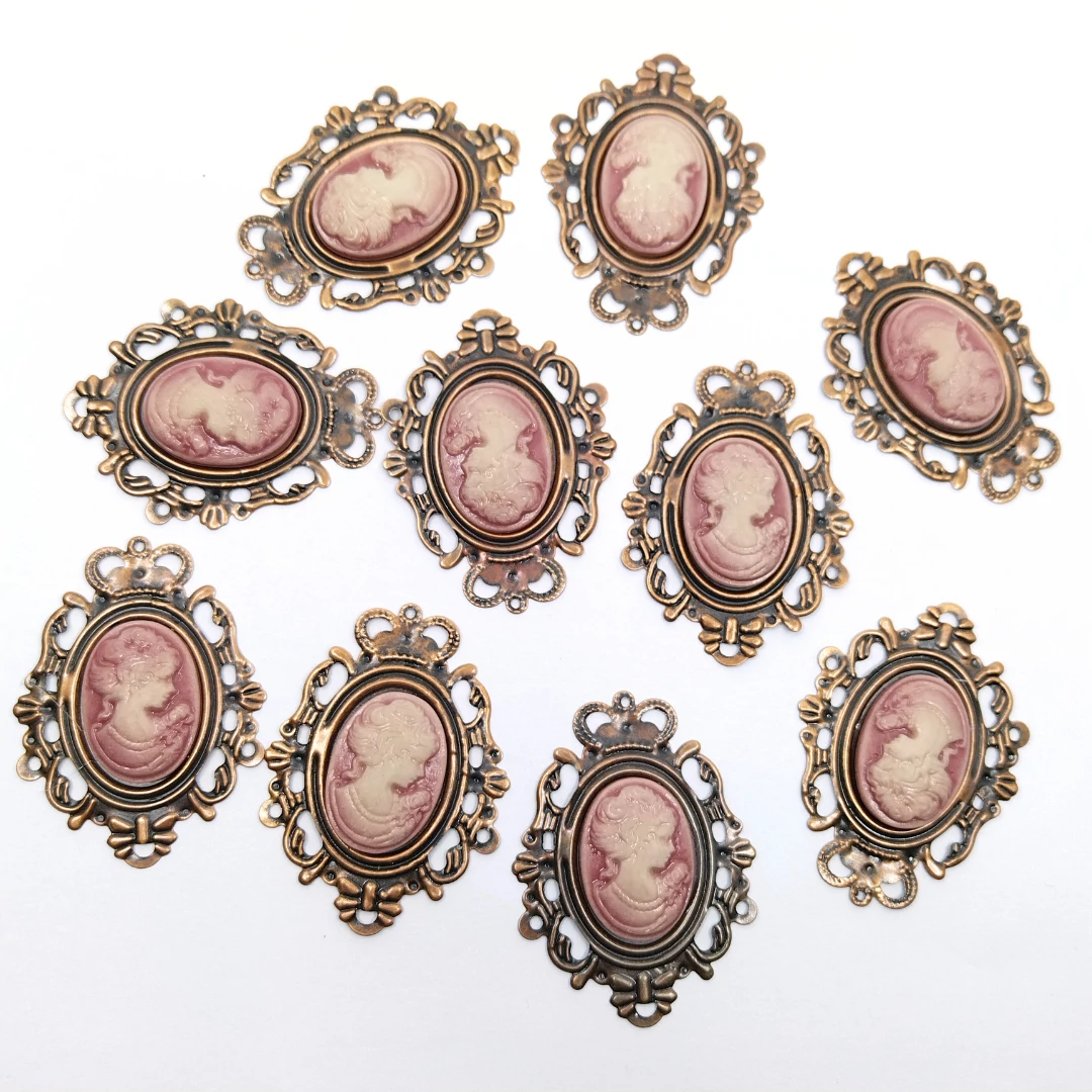 Bross ovális 10 db 5x3.8 cm, bronzos rózsaszín női portréval