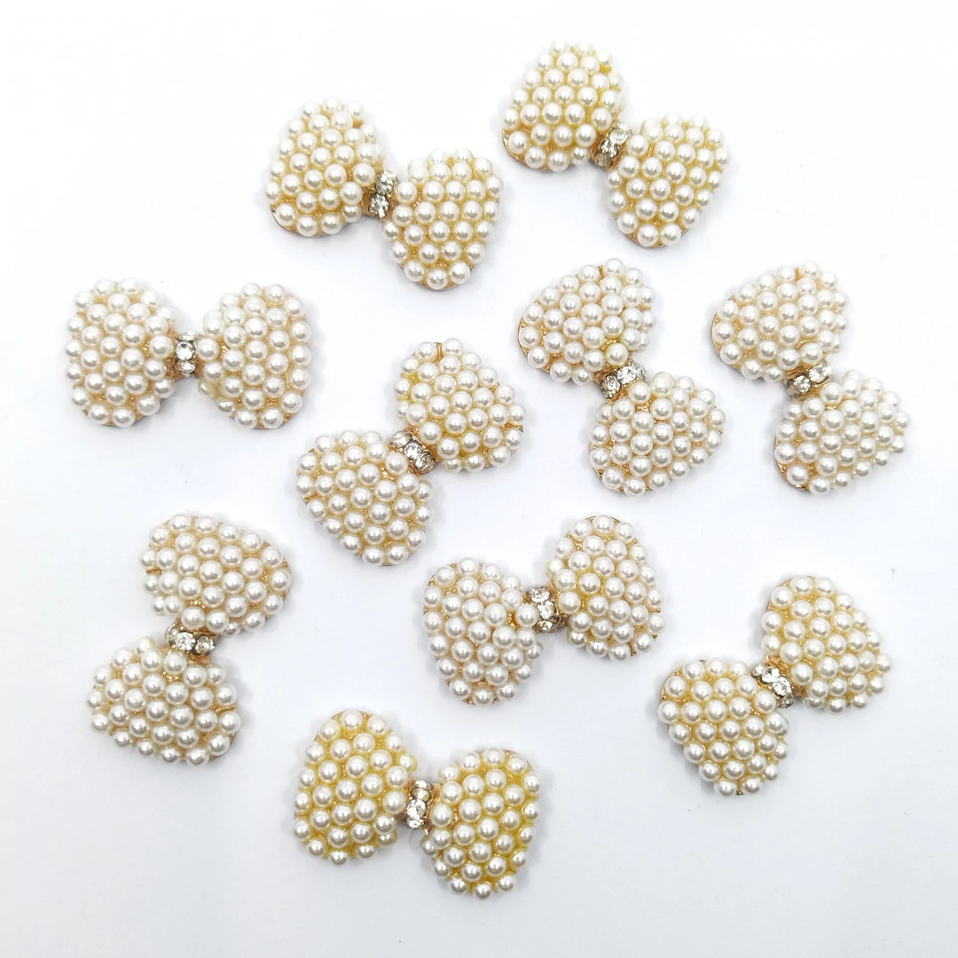 Bross gyöngyökkel masni alakú 10 db 3x1.9 cm, arany